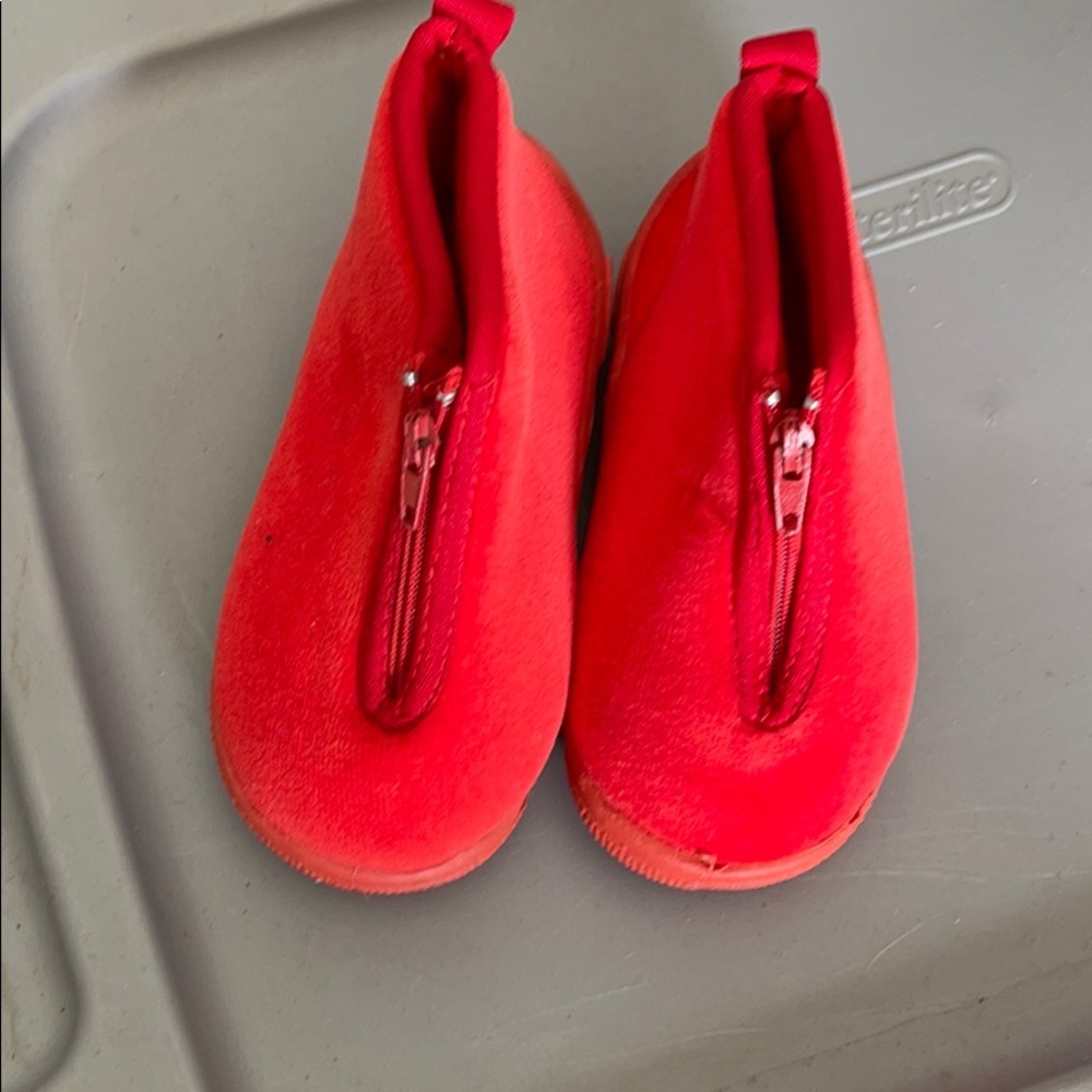 Red slippers with grippers on sole